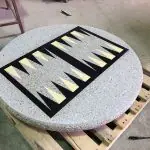 backgammon game on round slab of concrete