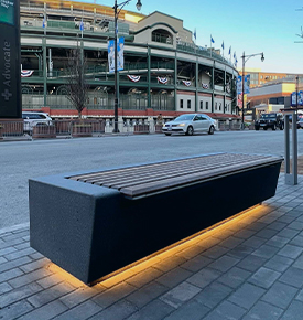 Custom concrete and wood backless bench outside of the Cub's stadium, Wrigley Field, in Chicago, Illinois